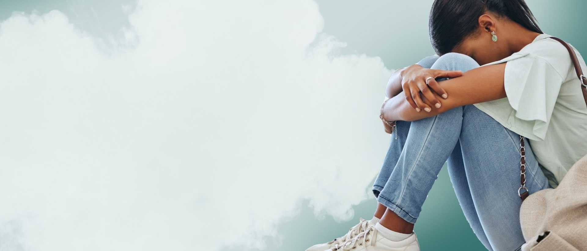 Teen sitting with smoke in the background